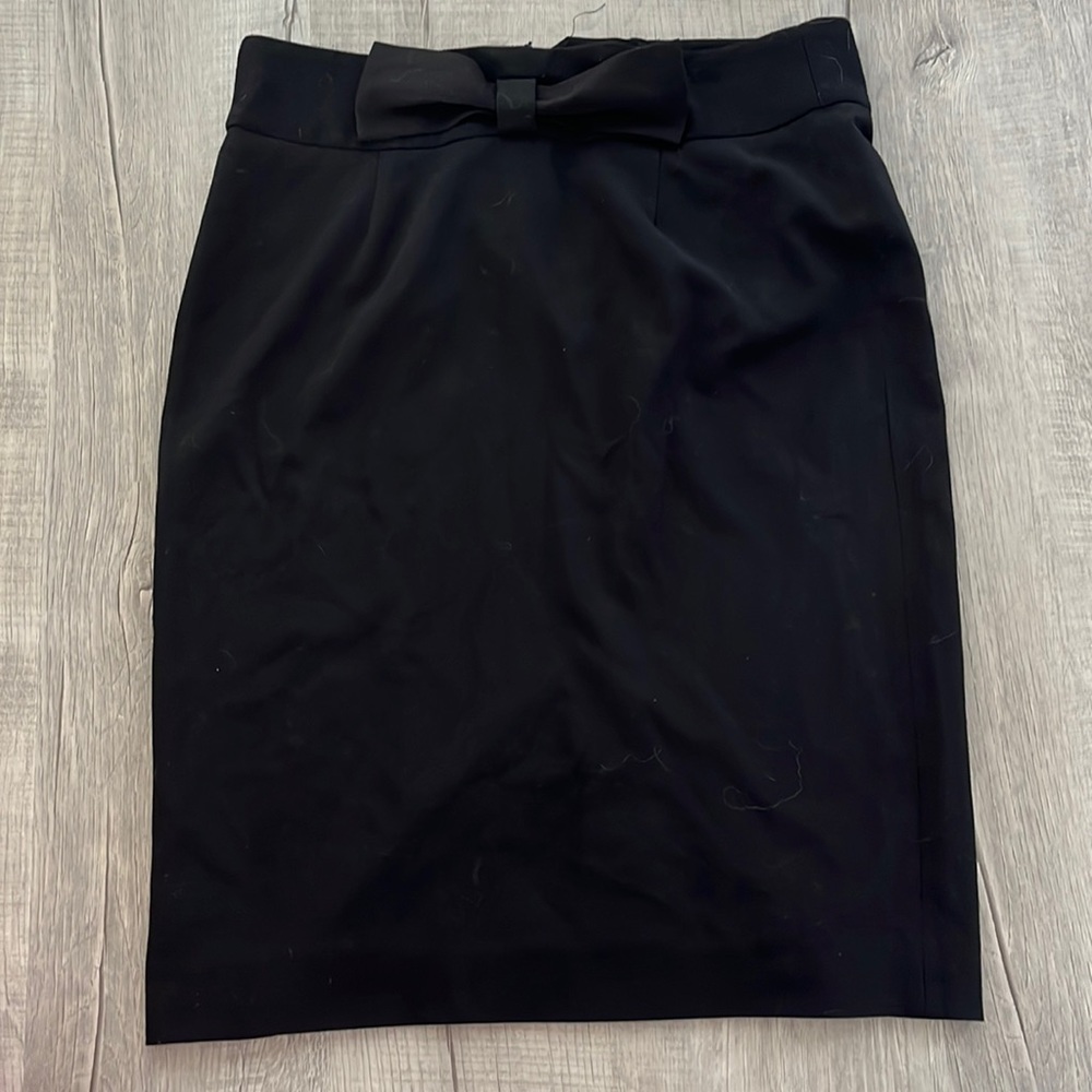 Knee length black skirt
